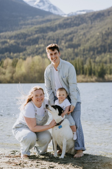 Devin Araujo with his wife Skylar, their baby and dog by the lake in Whistler BC